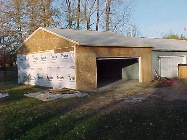 Barn addition-concrete &amp; OH door