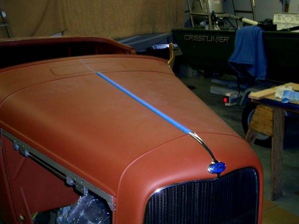 Hood trim &amp; badge in place.