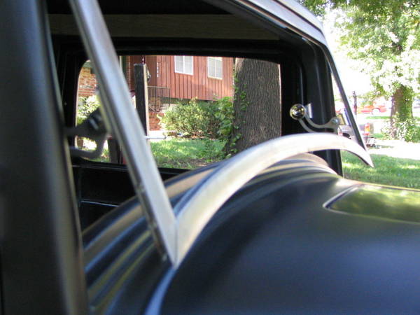 Swing out windshield